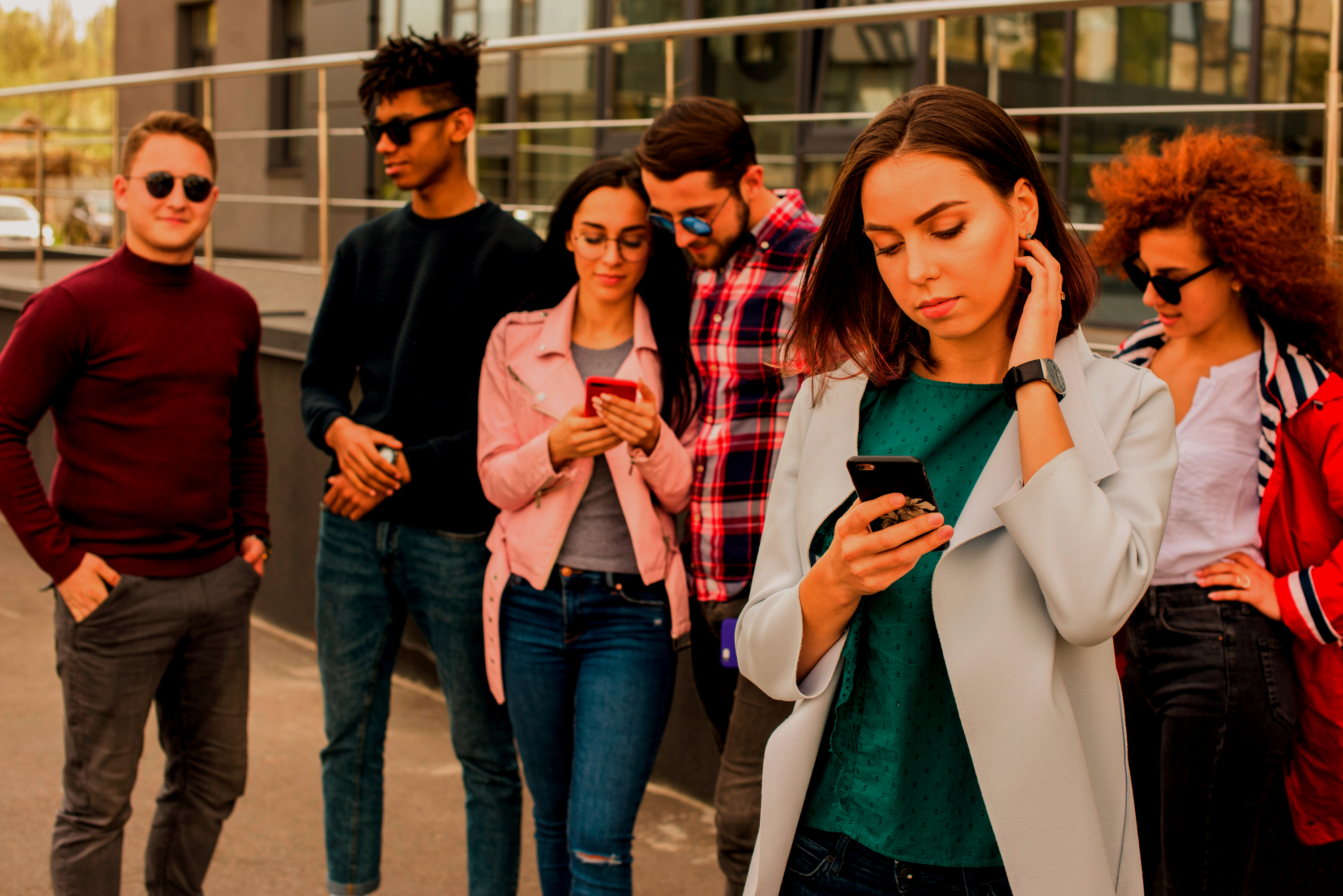 Group of people using phones